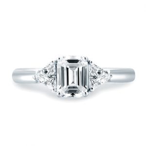 CLASSIC THREE STONE EMERALD CUT CENTER ENGAGEMENT RING