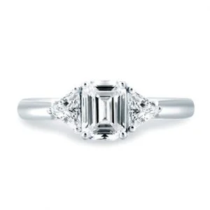 CLASSIC THREE STONE EMERALD CUT CENTER ENGAGEMENT RING